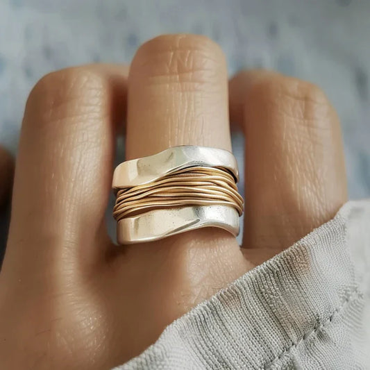 Silver Ring Adorned with Golden Threads
