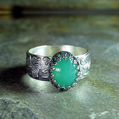 Emerald Ring with Intricate Flower Carving