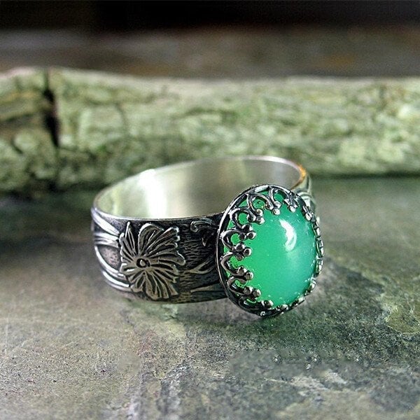 Emerald Ring with Intricate Flower Carving