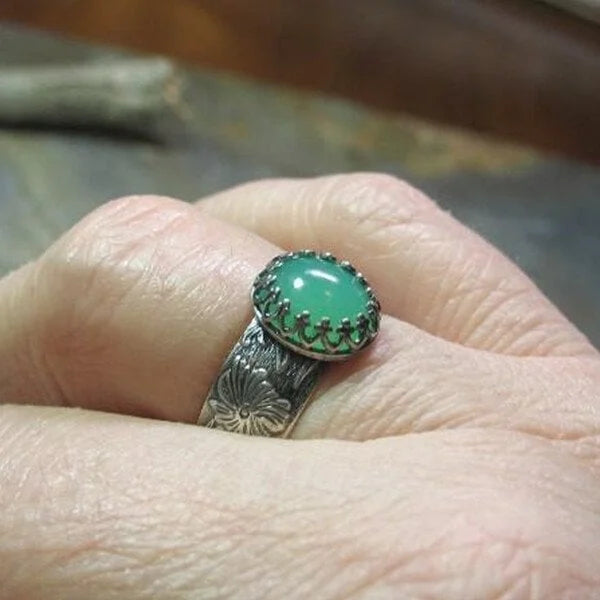 Emerald Ring with Intricate Flower Carving