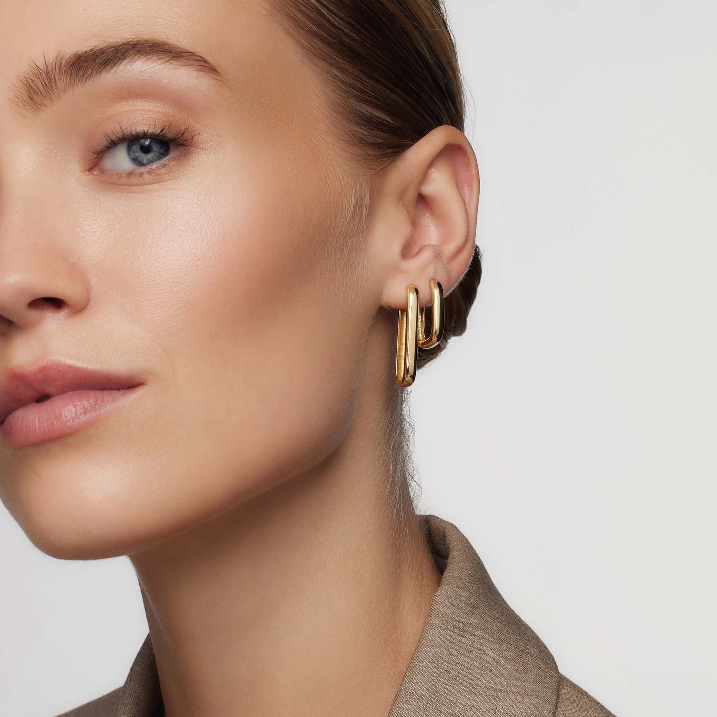 Golden Hoop Earrings with Iconic Design