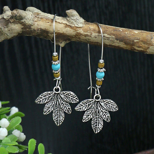 Bohemian Silver Leaf Earrings Adorned with Opal Stones