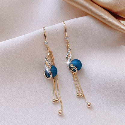 Holiday Earrings Adorned with Blue Beads