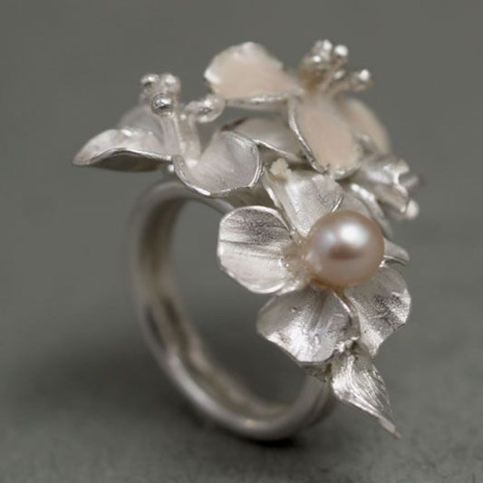 Pearl Ring with Silver Floral Design