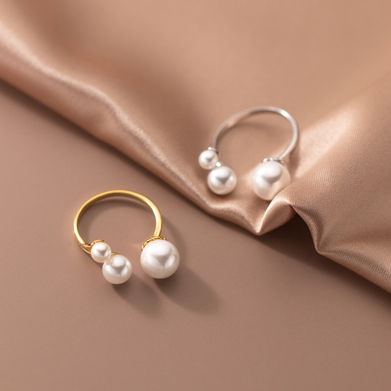 Adjustable Triple Freshwater Pearl Ring" can be rewritten as "Adjustable Ring with Three Freshwater Pearls.