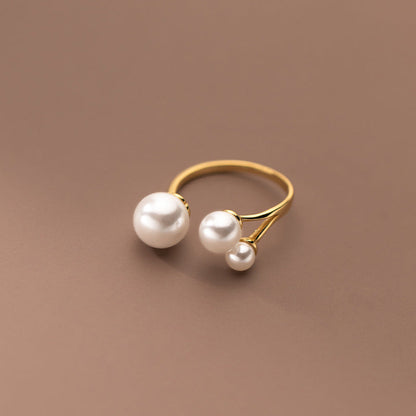 Adjustable Triple Freshwater Pearl Ring" can be rewritten as "Adjustable Ring with Three Freshwater Pearls.