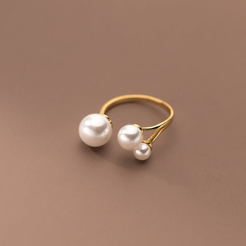 Adjustable Triple Freshwater Pearl Ring" can be rewritten as "Adjustable Ring with Three Freshwater Pearls.