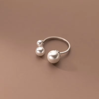 Adjustable Triple Freshwater Pearl Ring" can be rewritten as "Adjustable Ring with Three Freshwater Pearls.