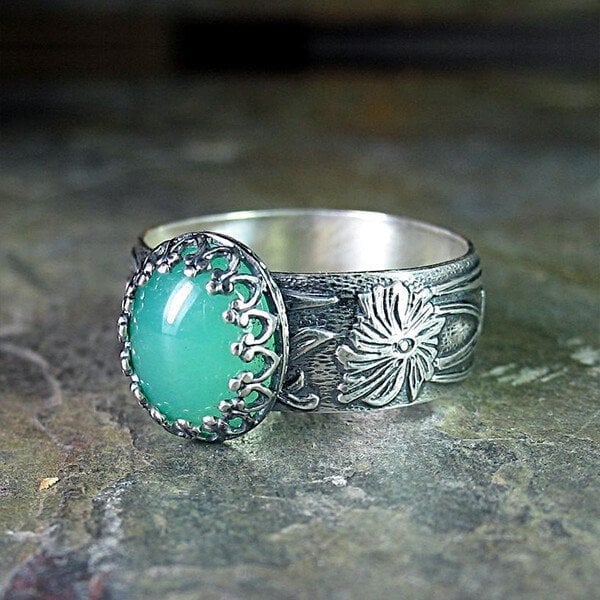 Emerald Ring with Intricate Flower Carving