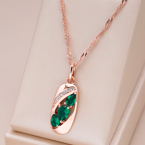 Gold Necklace Featuring a Green Crystal