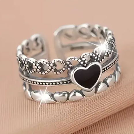 Silver Ring with Open Black Heart Design