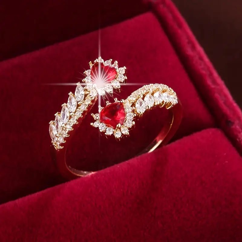 Gold Ring with Open Design and Red Zirconia