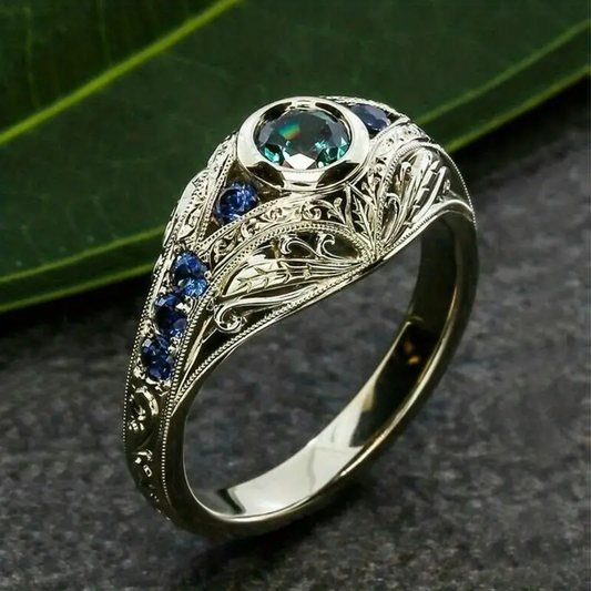 Silver Ring with Blue Hollow Design