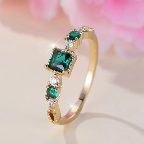 Radiant Gold Ring with Emerald Accent