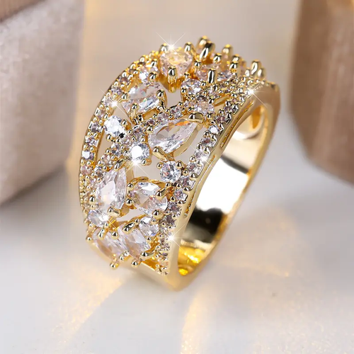 Gold Ring with Hollow Design and White Crystal Accents