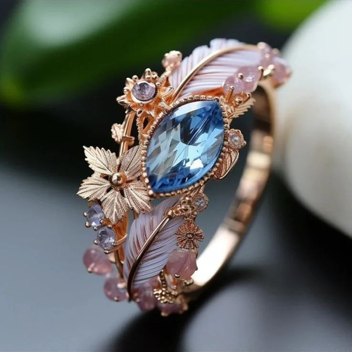 Stunning Blue Crystal Ring with Exotic Feather Design